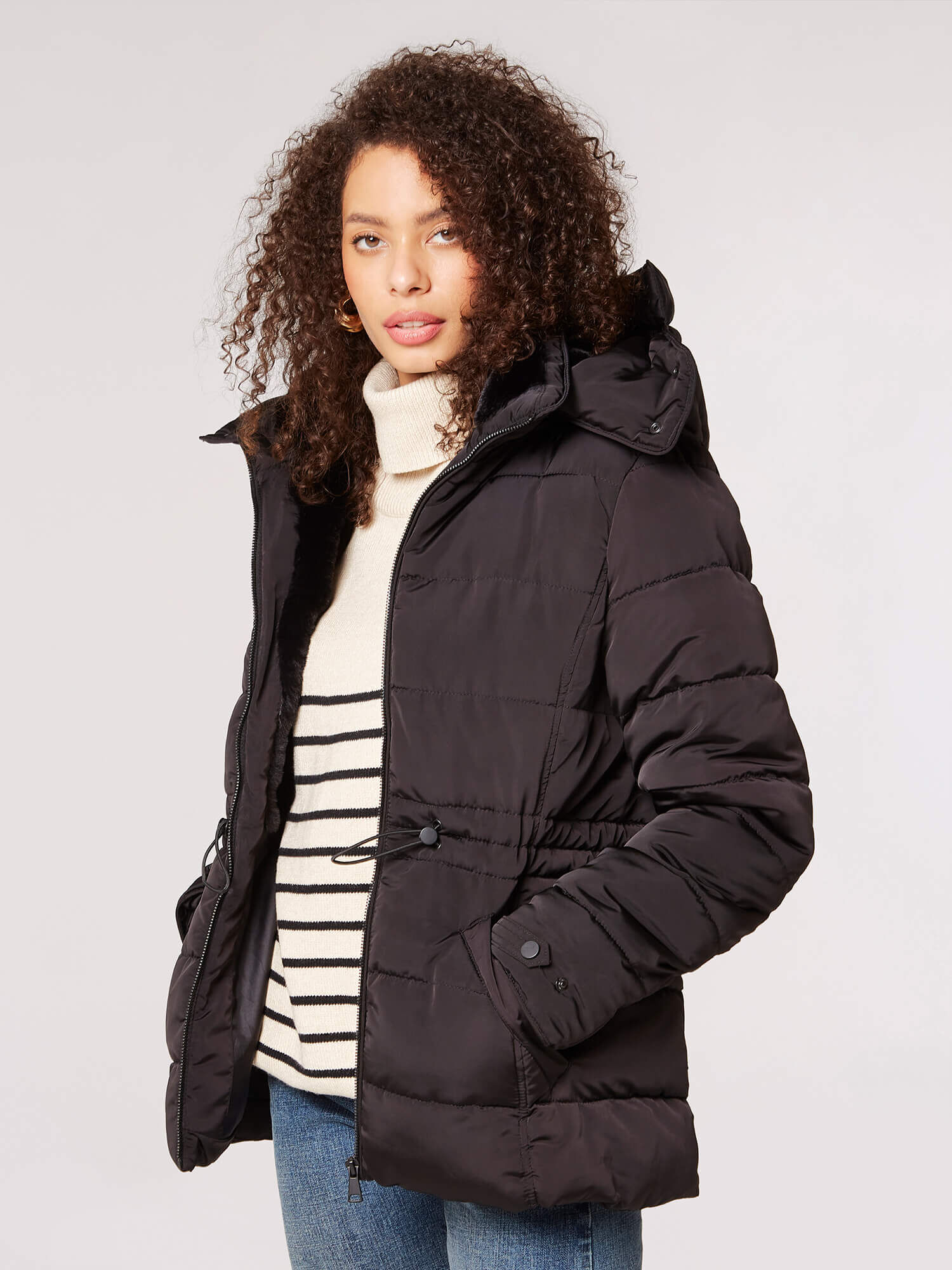 Puffer jacket with large fur hood clearance