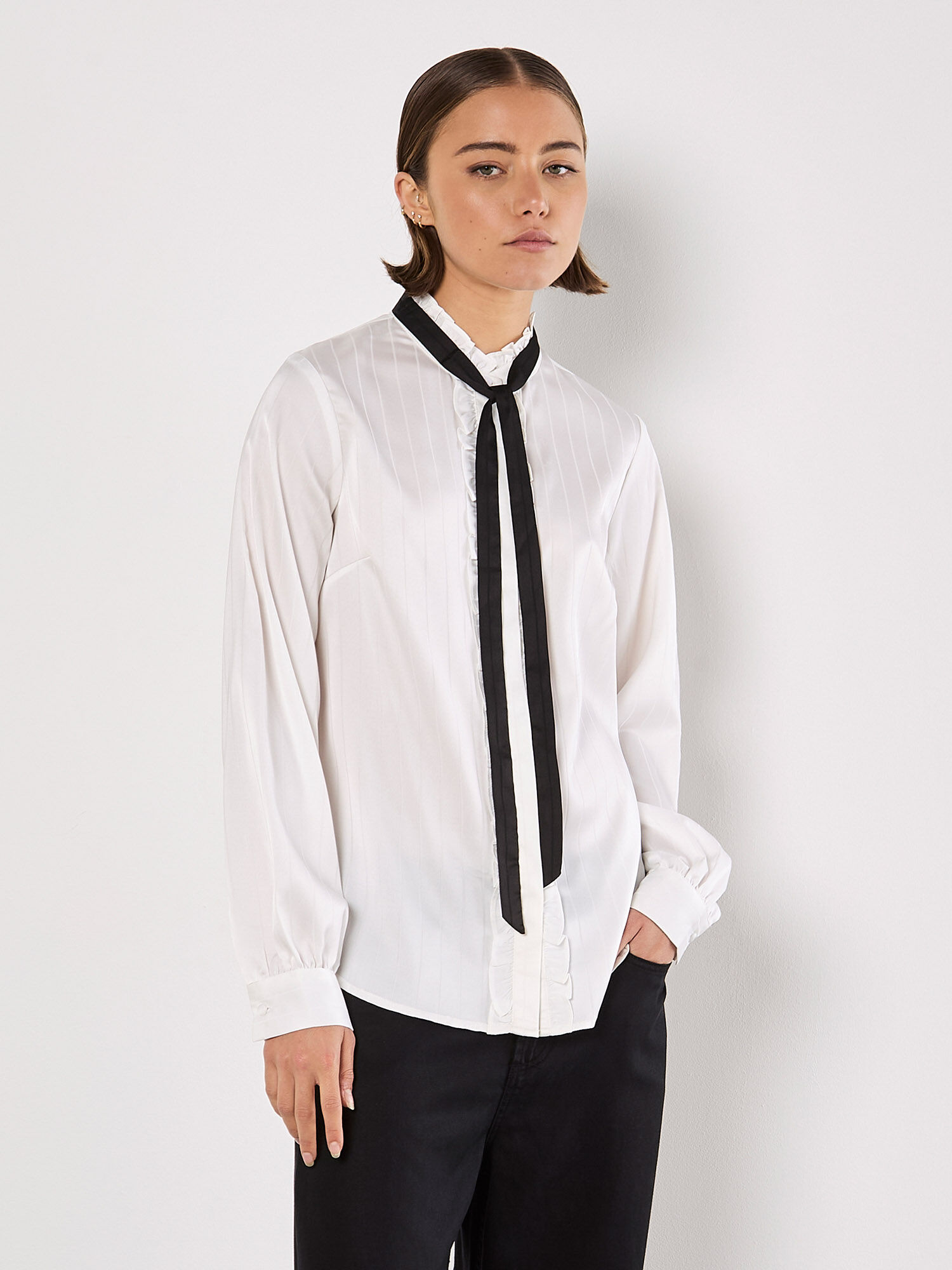white shirt with ruffle collar
