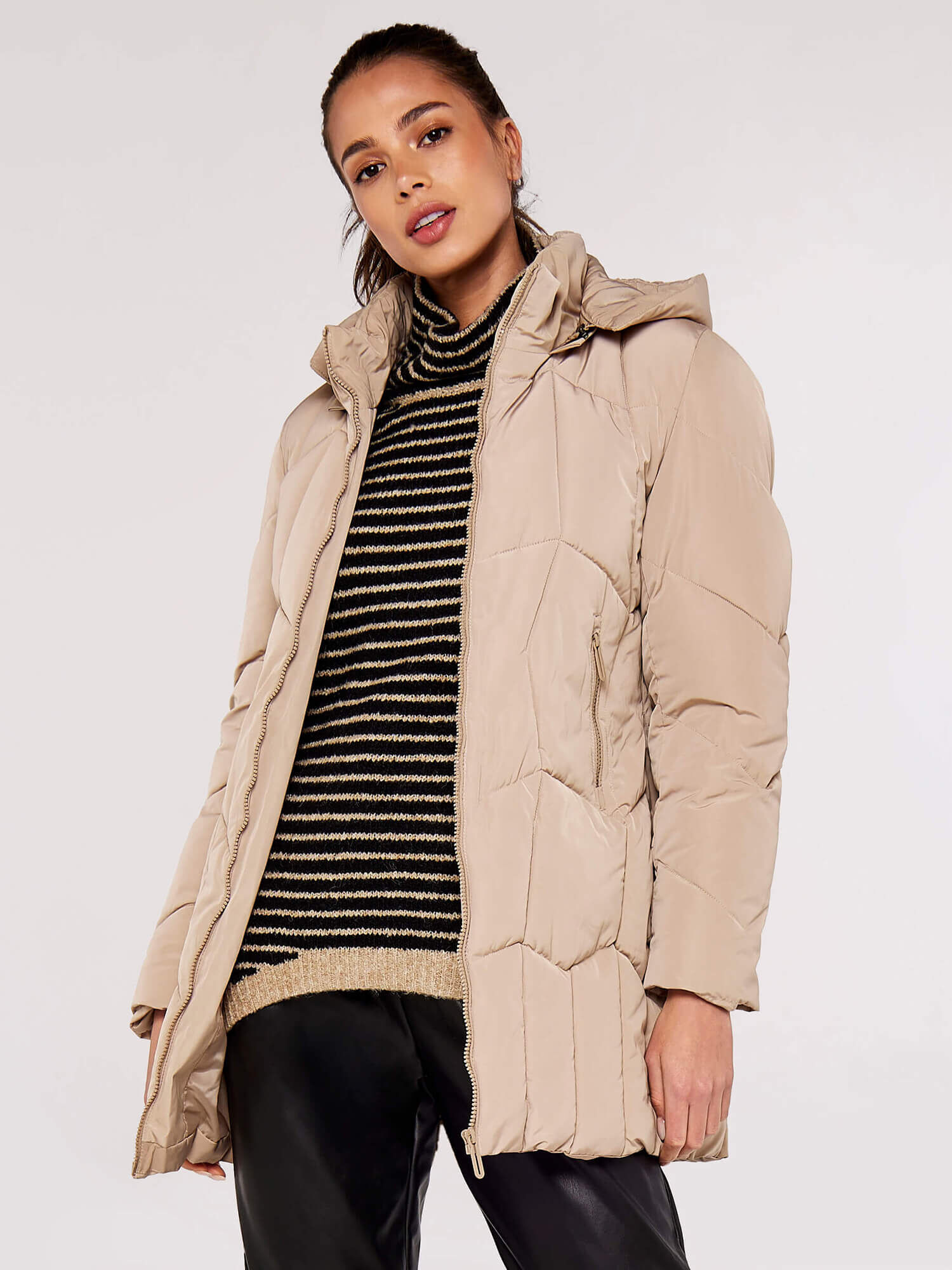 Beige puffer jacket with clearance fur hood