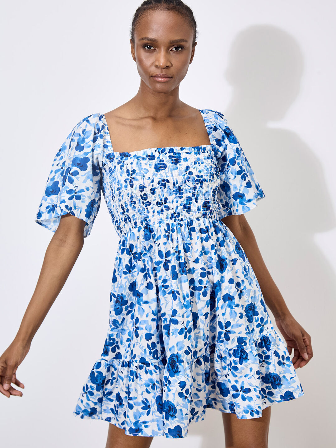 Image of Smocked Cotton Floral Mini Dress