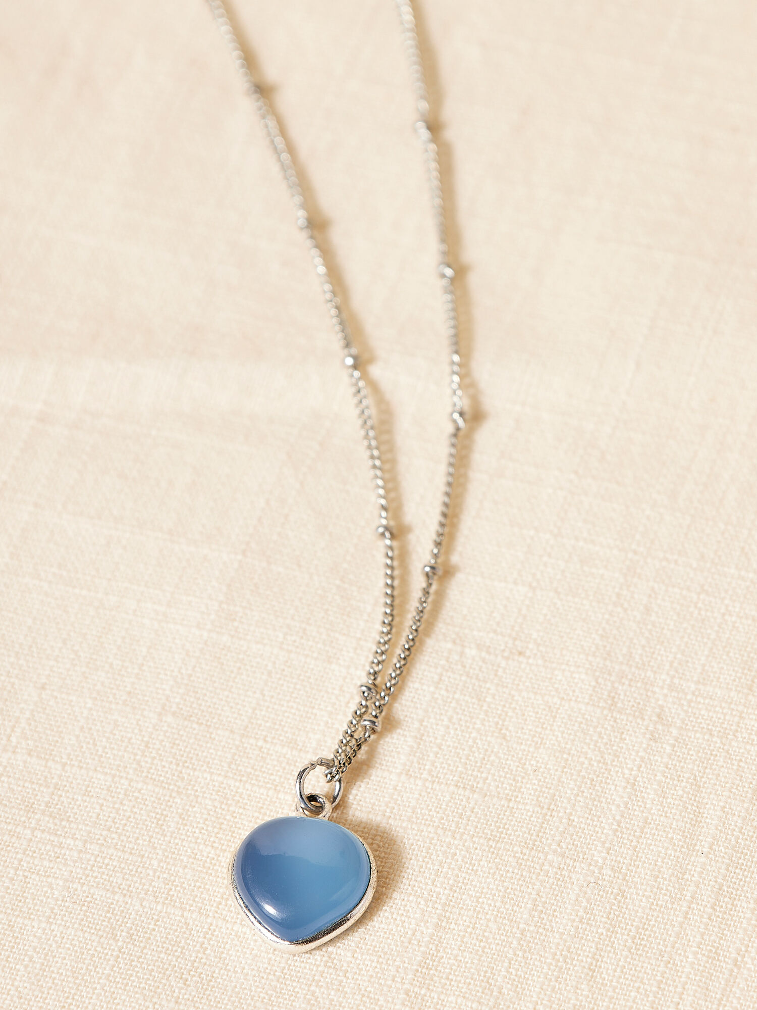 Silver heart necklace clearance with blue stone