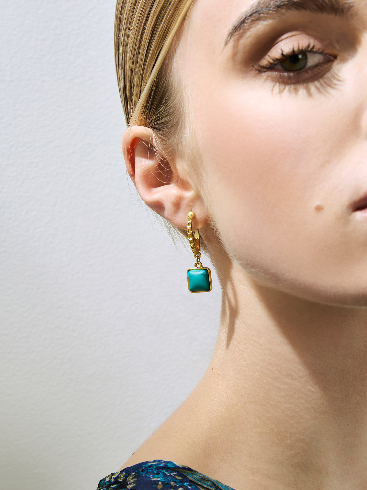 Teal stone earrings top