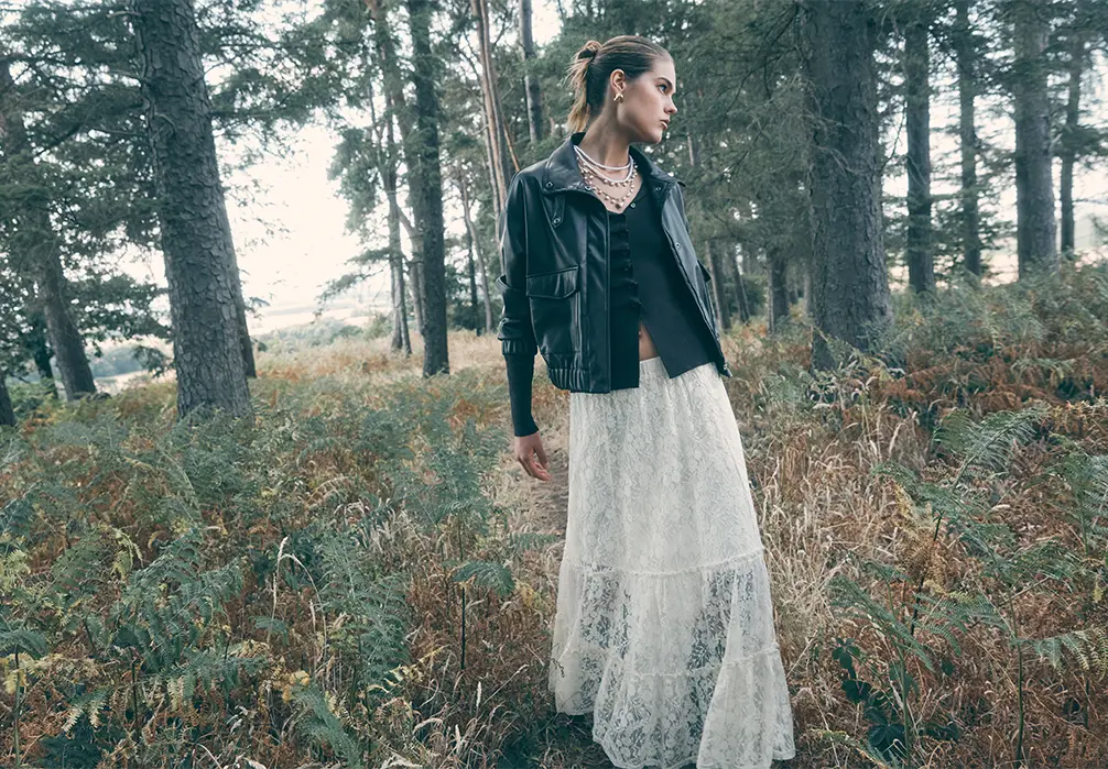 Model wearing a cream lace layered skirt