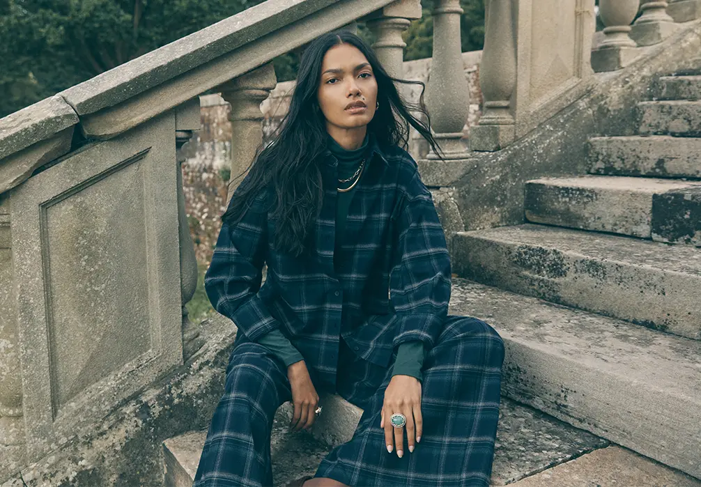 model wearing a blue and green shirt co-ord set