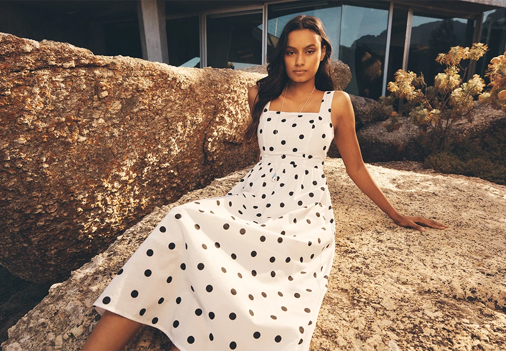 Model wearing Polka Dot Smocked Midi Dress