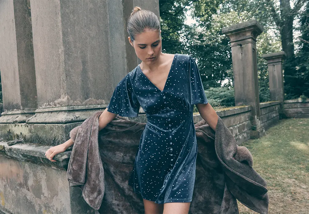 Model is wearing a Black Sparkly Velvet Mini Dress